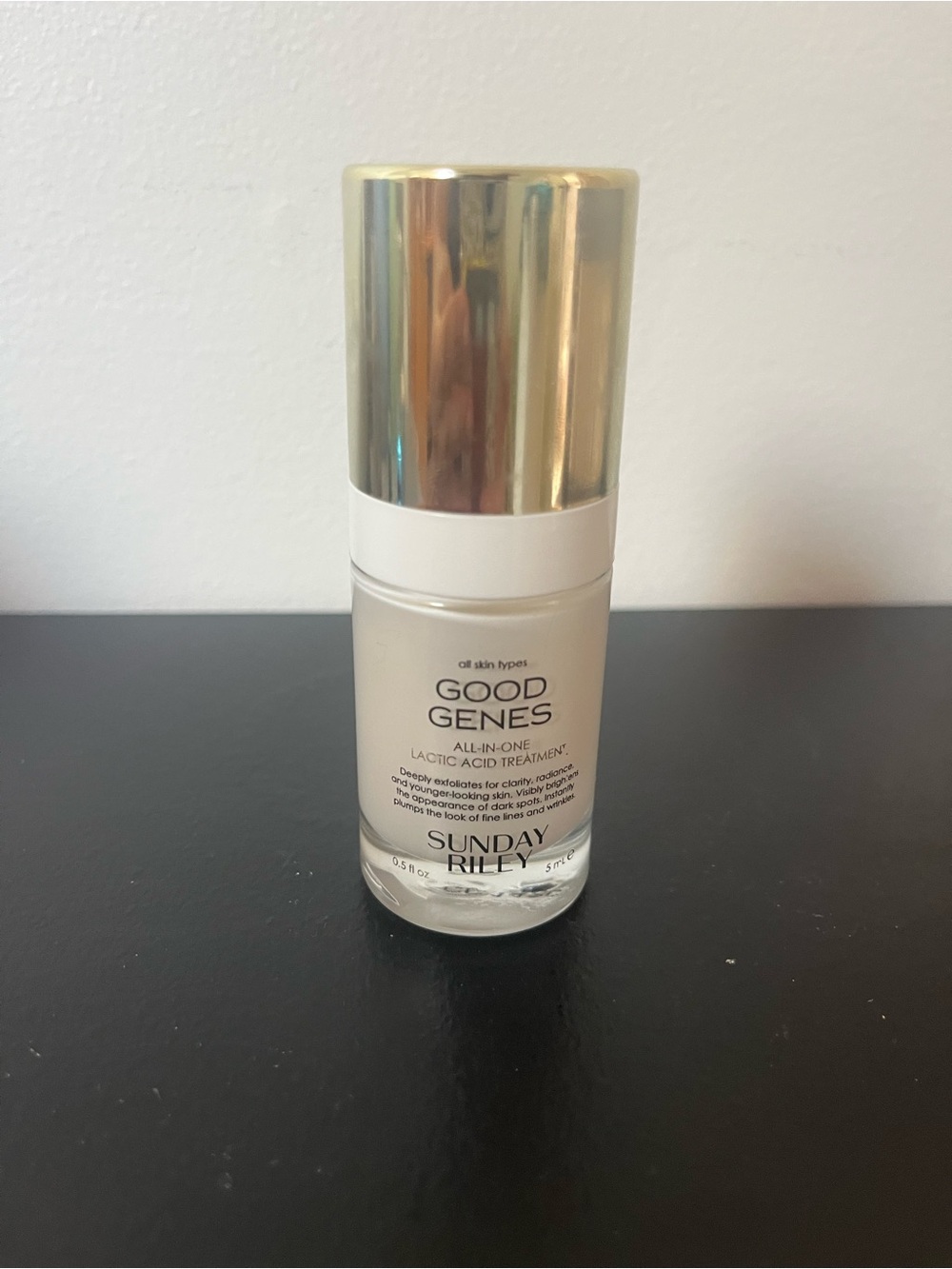 Sunday Riley Good Genes Serum Bottle with Gold Cap and White Band